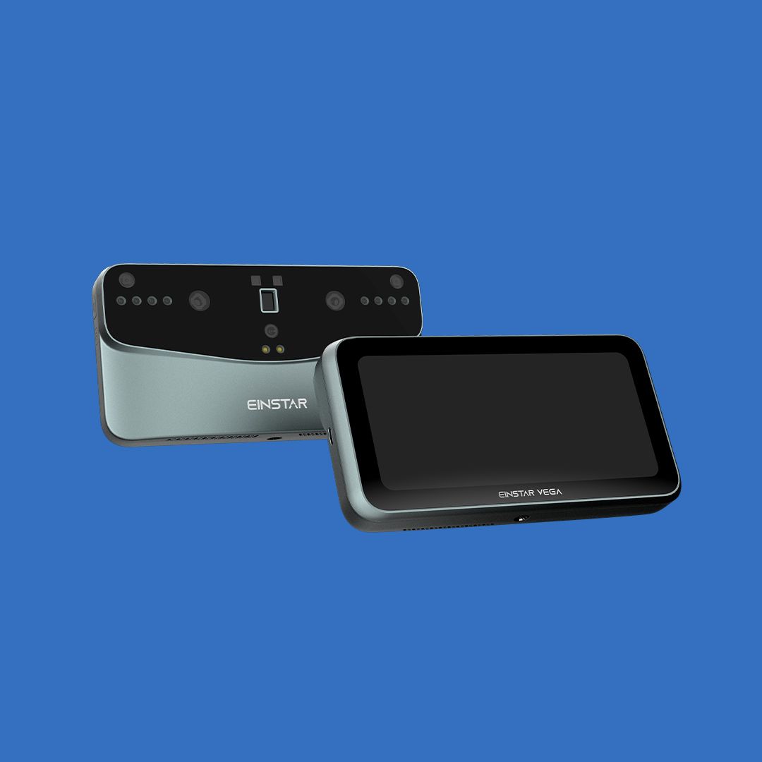 2 EINSTAR VEGA 3D scanners on a blue background. One front facing and one back facing.