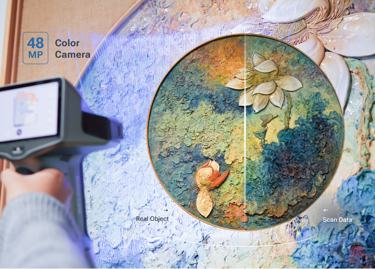 A hand holds the EinScan Libre while scanning a textured artwork, with a split-screen view comparing real colours to the captured scan data.