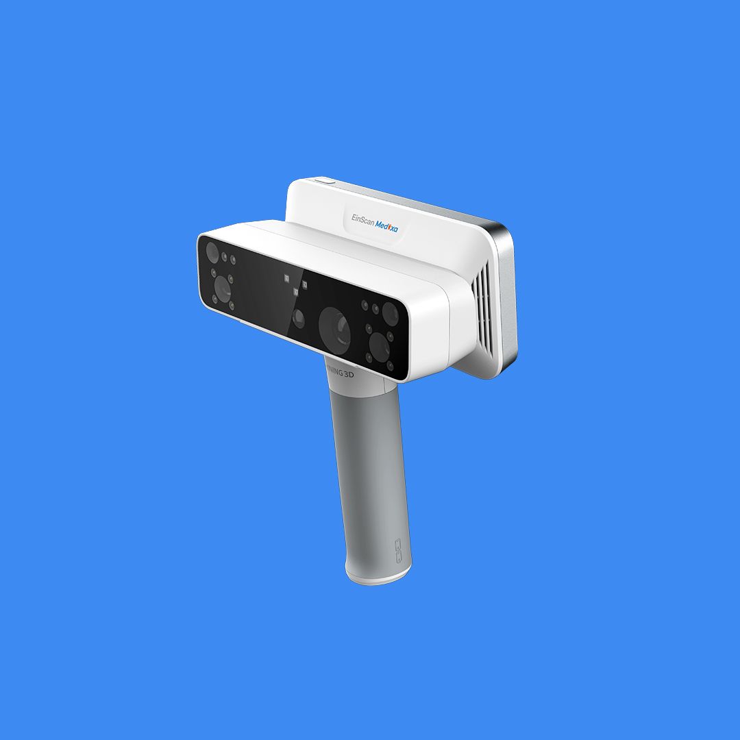 Front view of the EinScan Medixa handheld 3D scanner against a blue background, showing its white body, black sensor array and ergonomic grey handle.