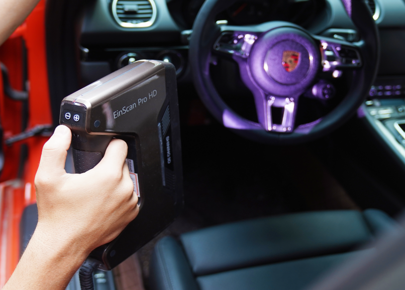 EinScan Pro HD being used to scan the interior of a car, ideal for capturing complex automotive shapes.
