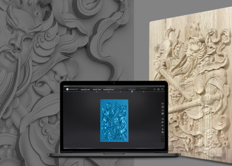 High-resolution scan data from the EinScan Pro HD shown on a laptop next to an intricately carved wooden artwork.