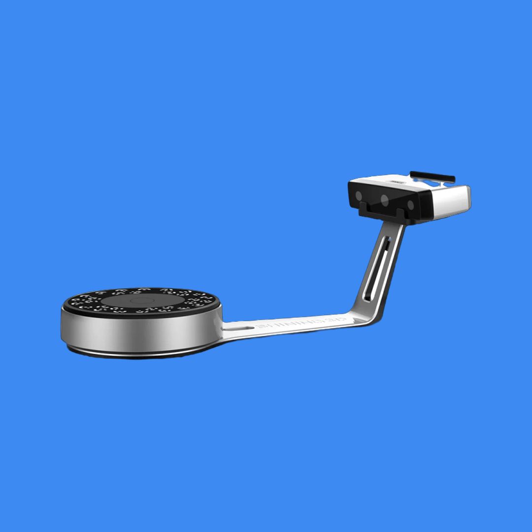 EinScan SP V2 scanner with turntable shown against a blue background, showcasing the full desktop scanning setup.