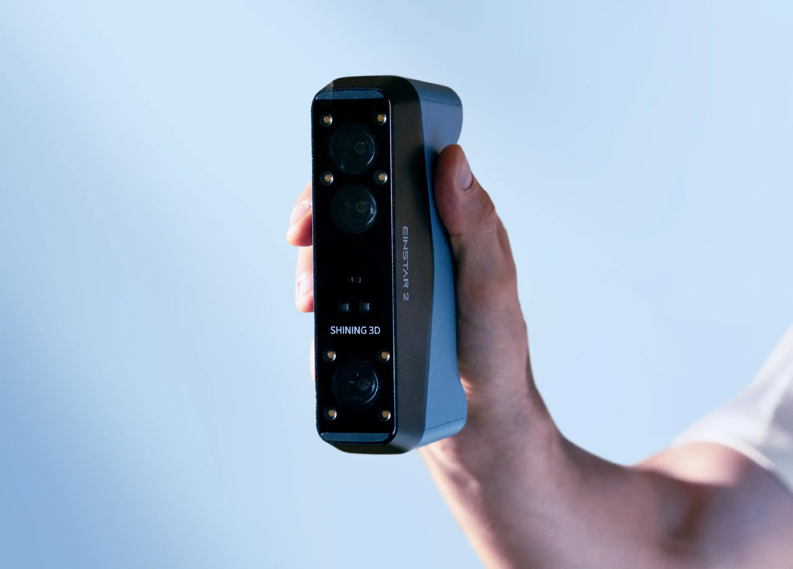 Close-up of EINSTAR 2 held in one hand, showing its compact, lightweight design.