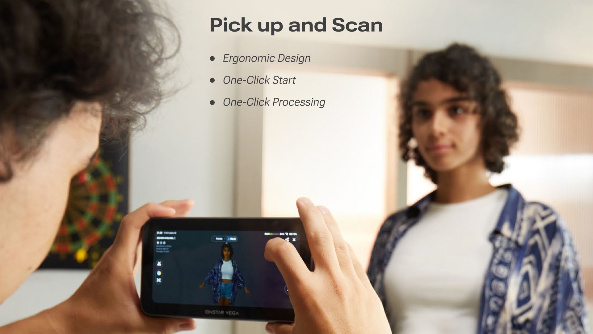 A person holding the EINSTAR VEGA and starting a portrait scan using the touchscreen interface during a simple one-click setup.
