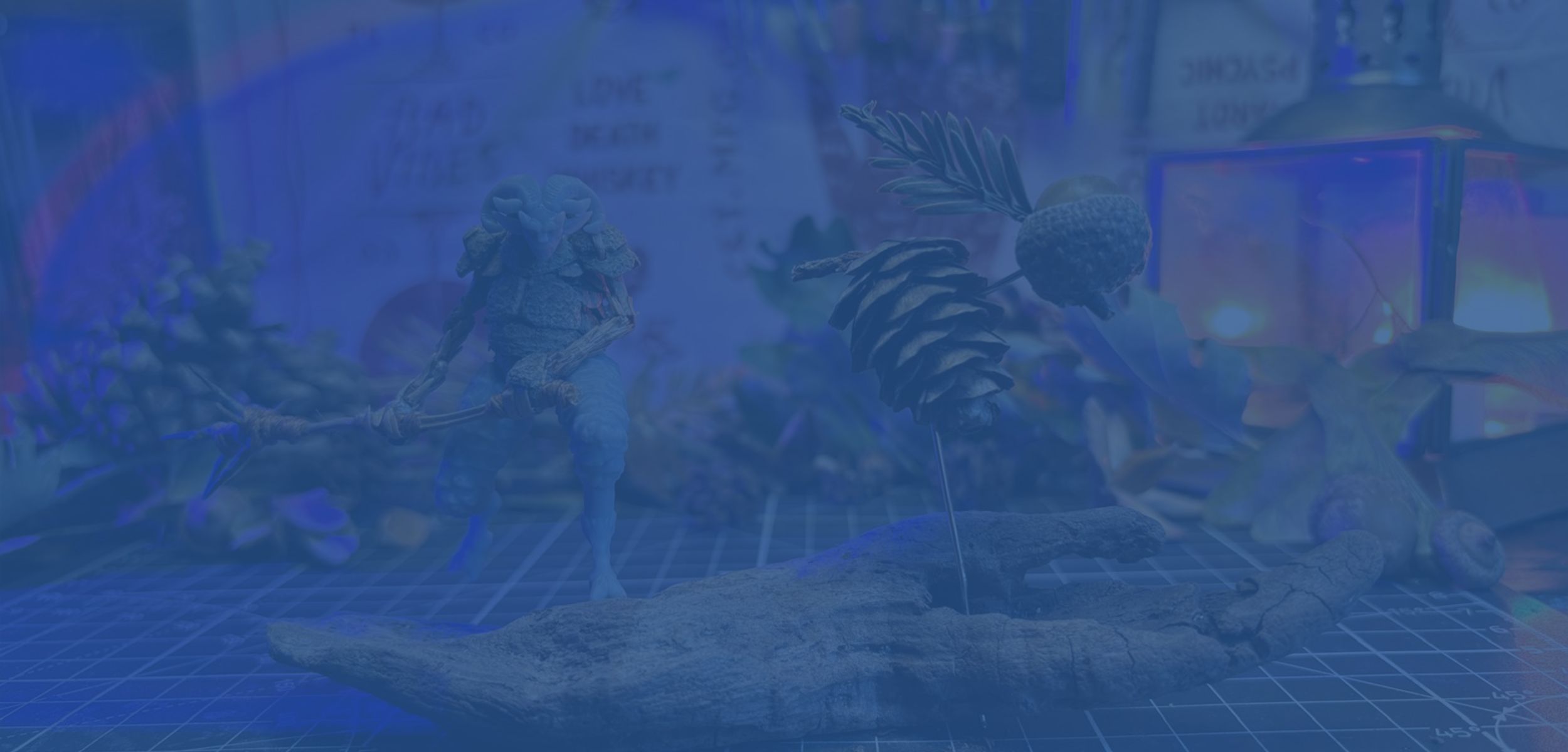 A fantasy miniature creature displayed alongside scanned natural objects such as pinecones and acorns, showing the organic shapes used to create the 3D-designed game model.